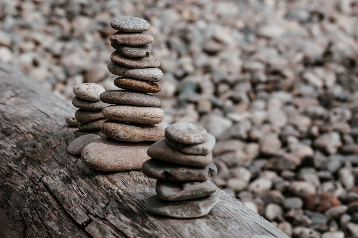 small-rock-piles-on-log r